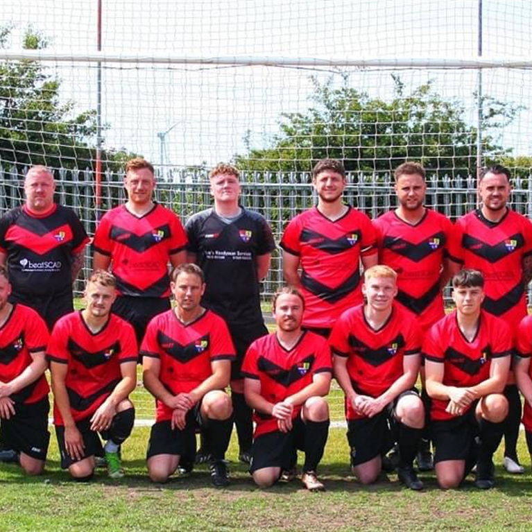 Ellington FC sports Beat SCAD logo on football strip